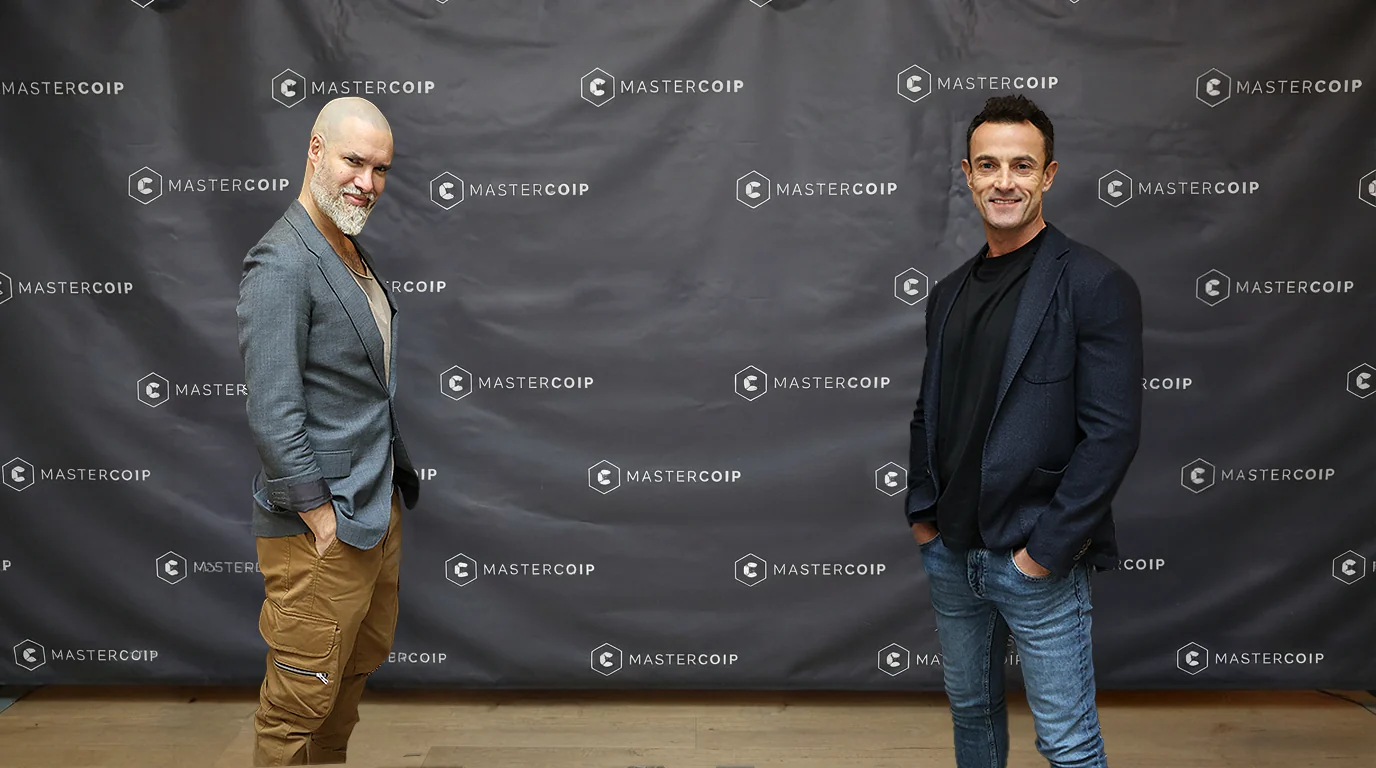 Drs. Iván Malagón and Diego Peydro in front of the MasterCOIP photocall